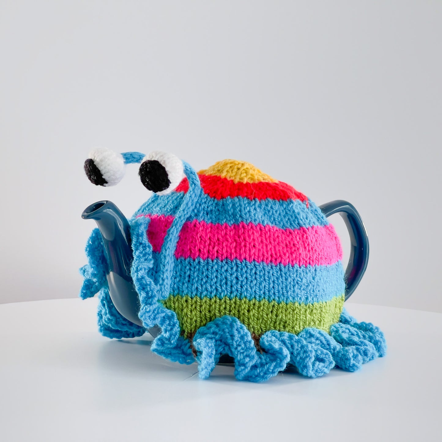 Ruperts house stripy snail tea cosy