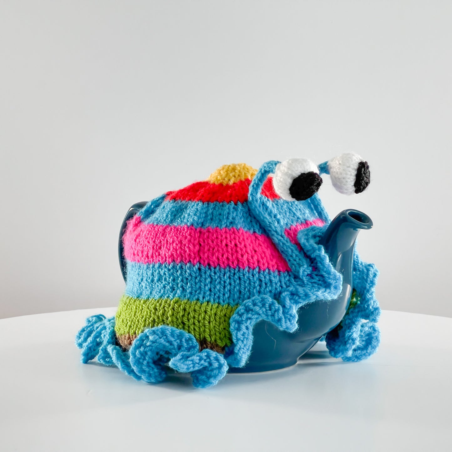 Ruperts house stripy snail tea cosy