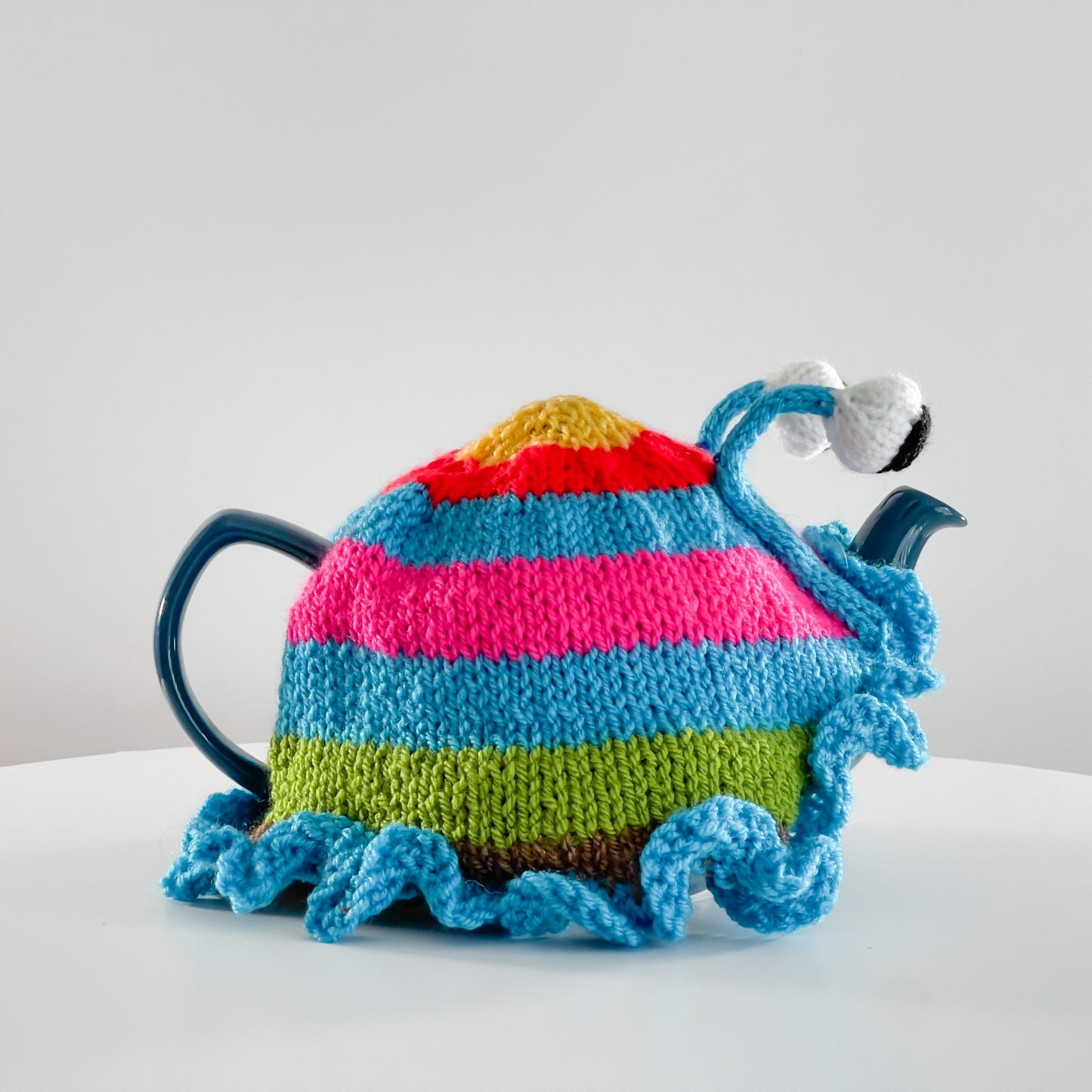 Ruperts house stripy snail tea cosy