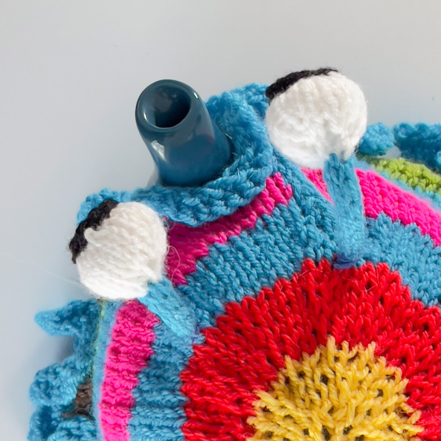Ruperts house stripy snail tea cosy