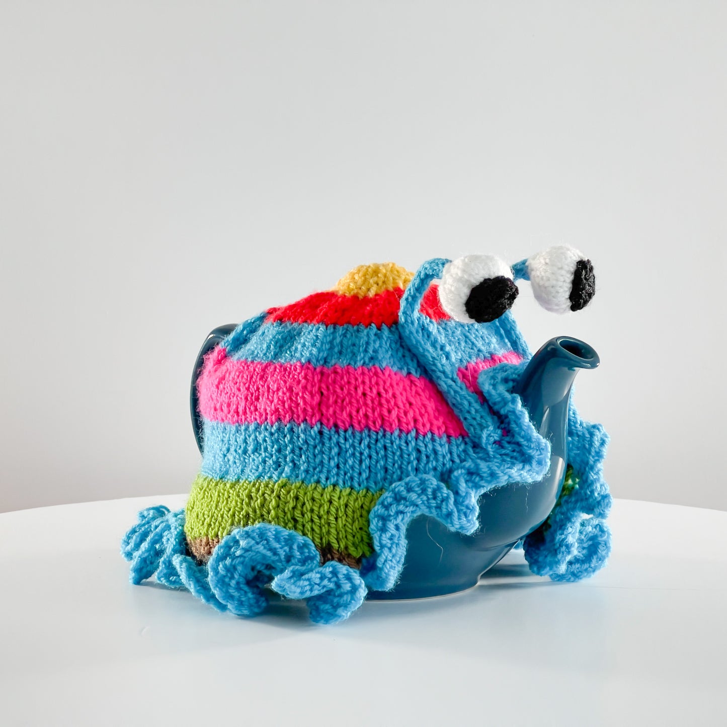 Ruperts house stripy snail tea cosy
