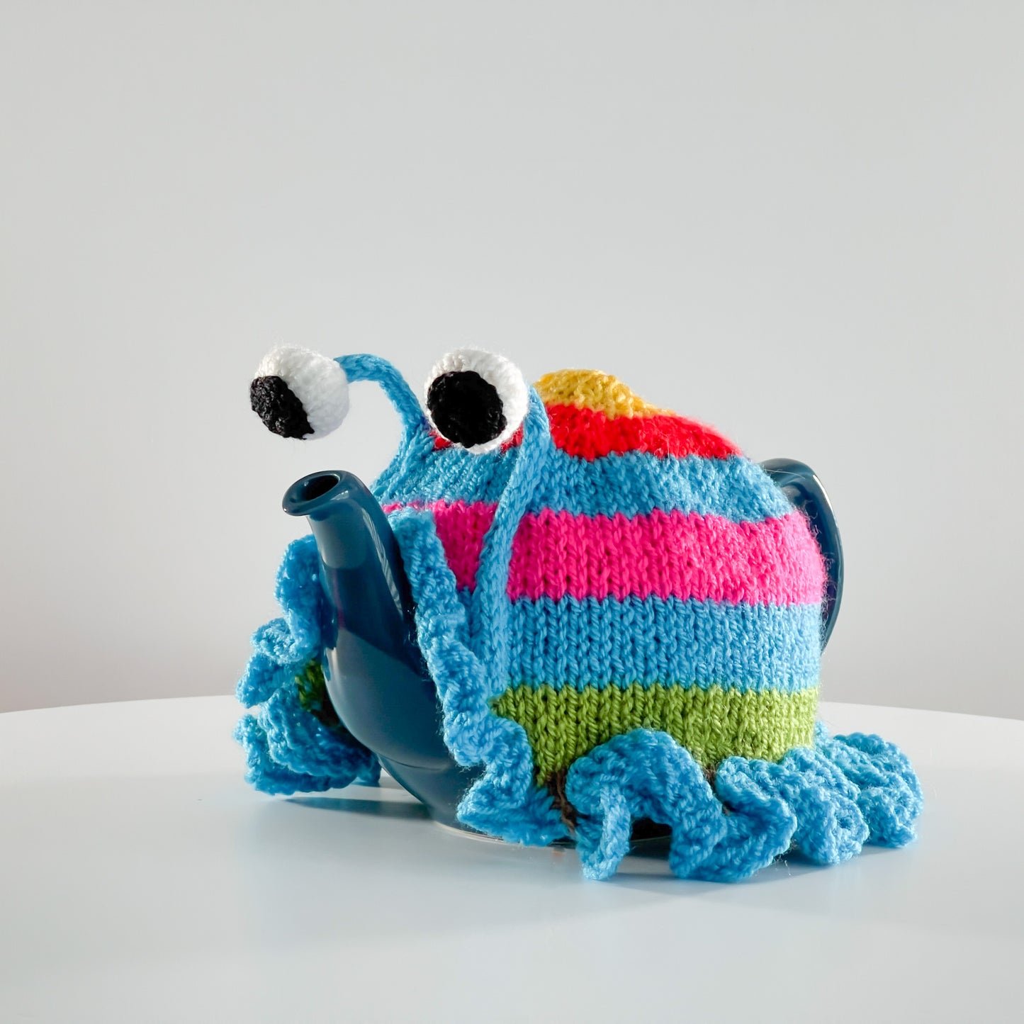 Ruperts house stripy snail tea cosy