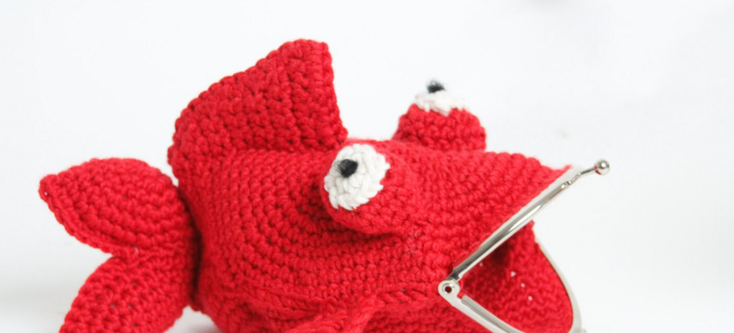Fish crochet purse with snap clasp fastening. Hand crochet in soft sheen red yarn.