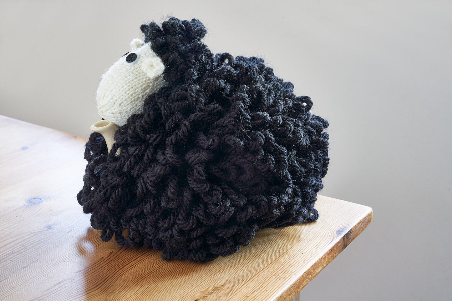 Mabel the sheep tea cosy hand knitted in chunky cream yarn
