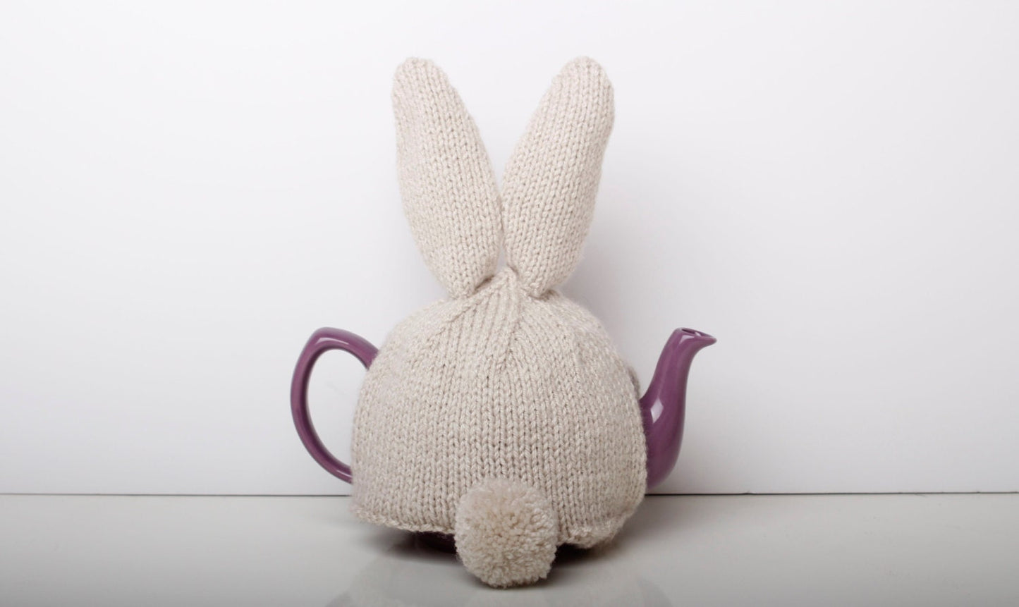 Hand knitted bunny rabbit tea cosy with pom pom bottom. Fits either 6 cup or 2 cup tea pots.
