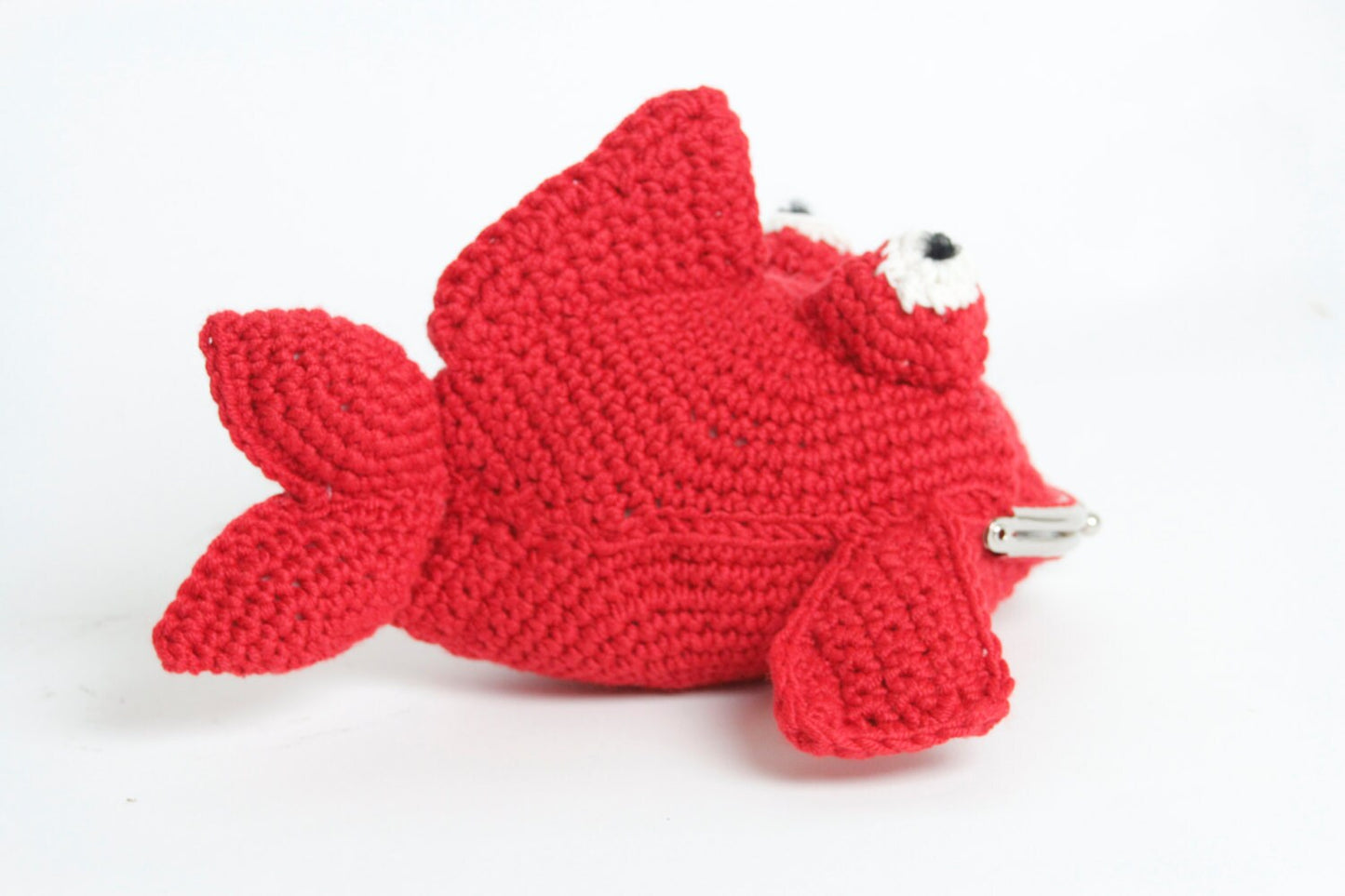 Fish crochet purse with snap clasp fastening. Hand crochet in soft sheen red yarn.
