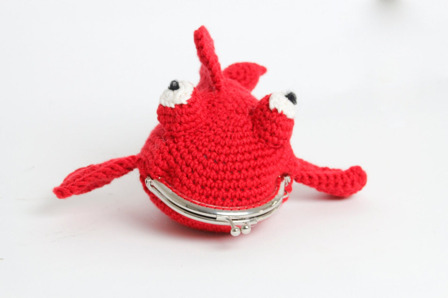 Fish crochet purse with snap clasp fastening. Hand crochet in soft sheen red yarn.