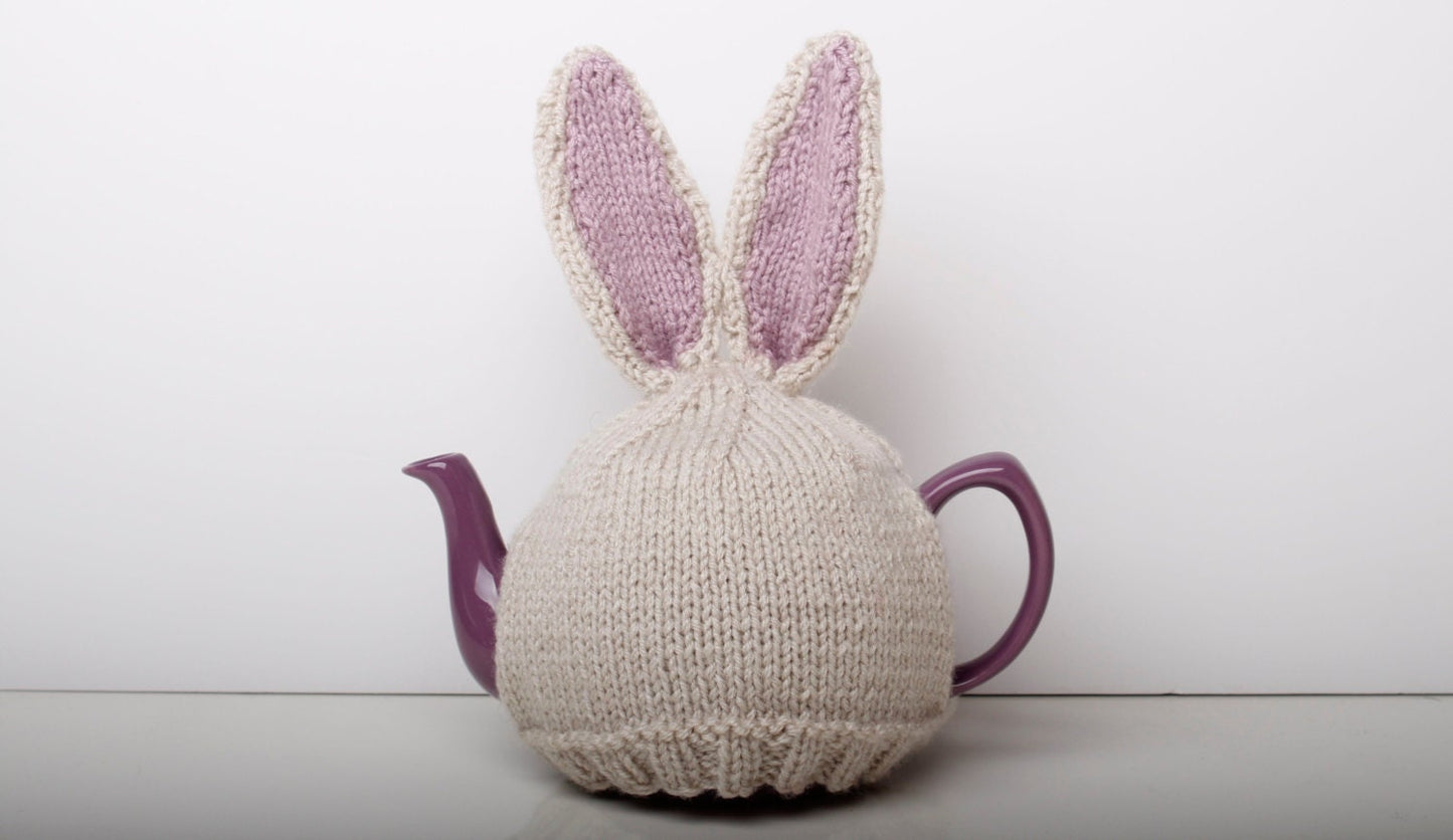 Hand knitted bunny rabbit tea cosy with pom pom bottom. Fits either 6 cup or 2 cup tea pots.