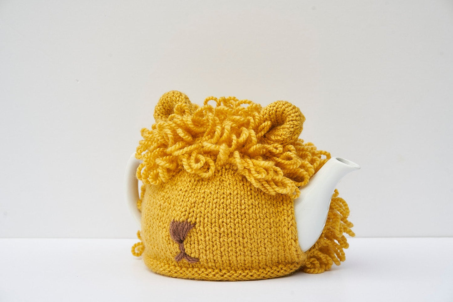 Lion tea cosy with loopy shaggy hand knitted mane for 6 cup tea pot