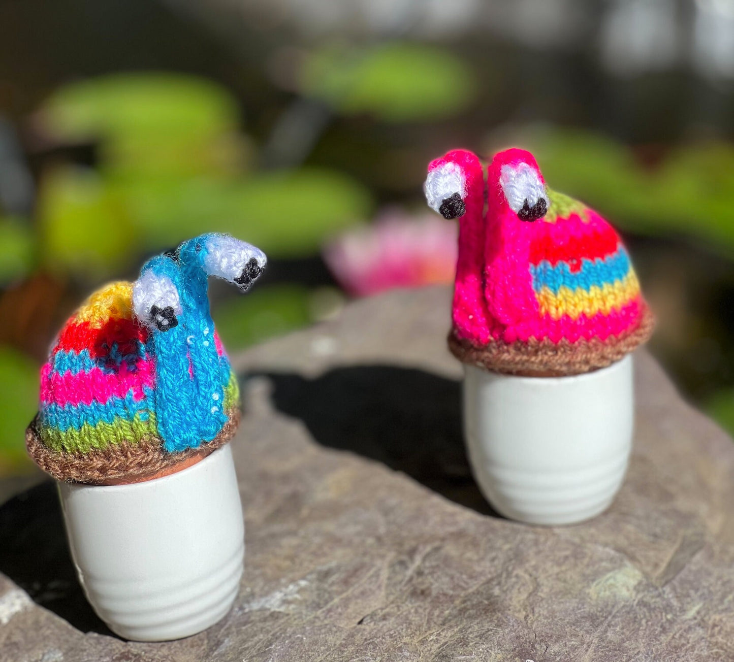 Knitted pink stripy snail tea cosy. Tea lovers teatime treat.