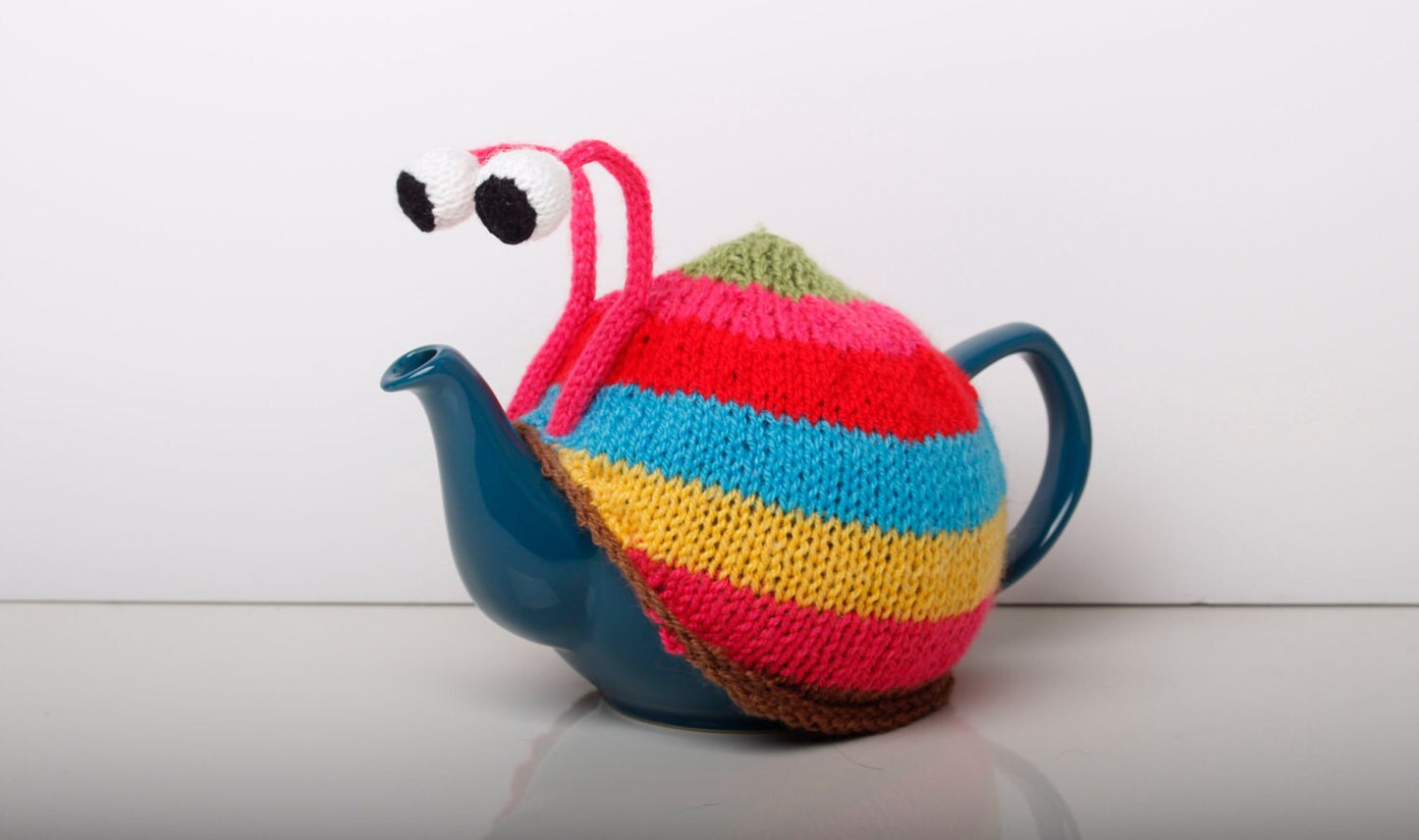 Knitted pink stripy snail tea cosy. Tea lovers teatime treat.