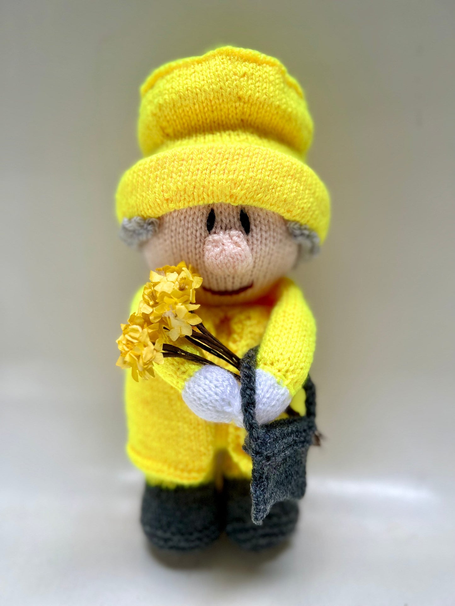 Queen Elizabeth II hand knitted character available in a variety of colours. Handbag on left or right with accessories …