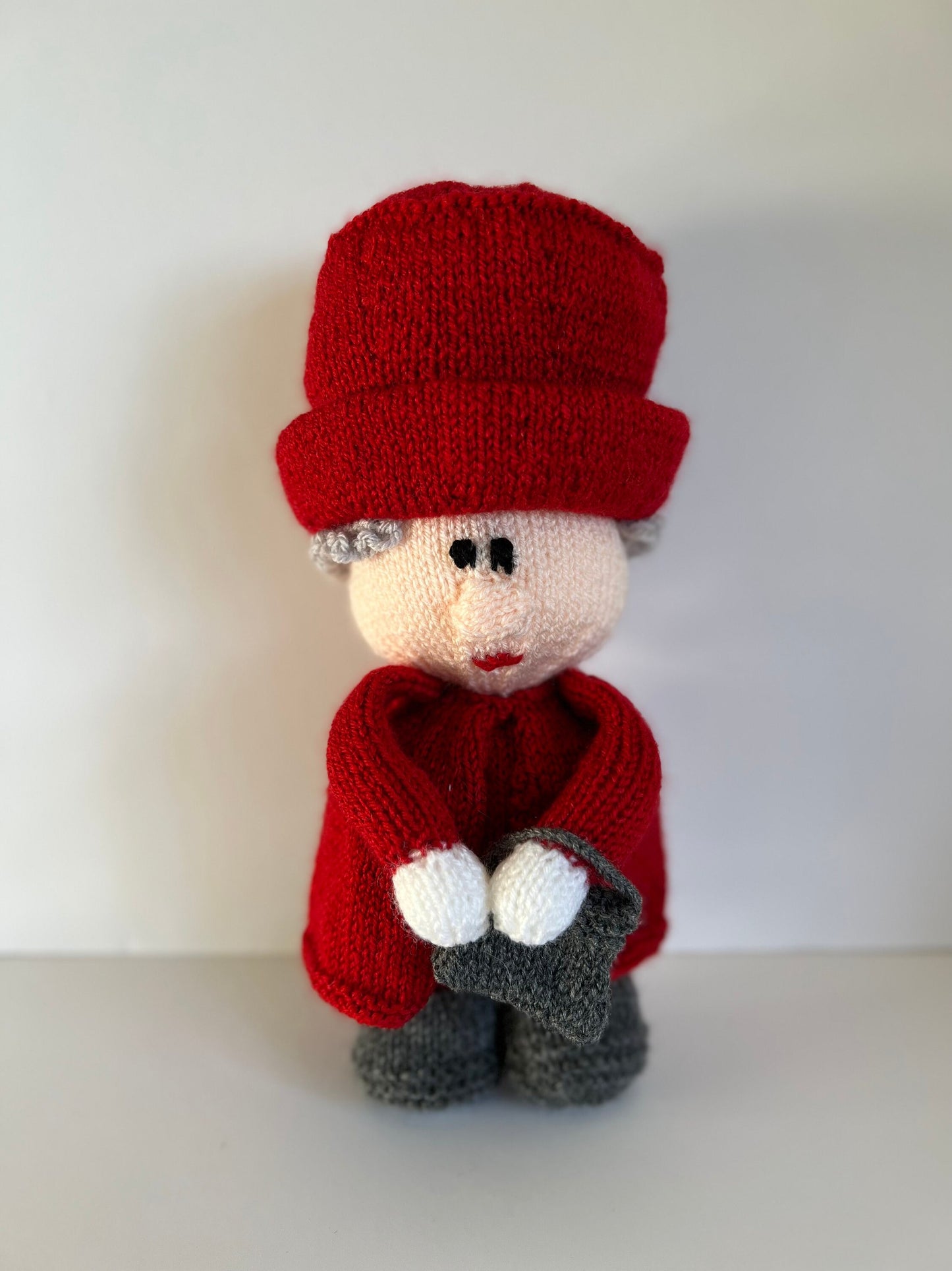 Queen Elizabeth II hand knitted character available in a variety of colours. Handbag on left or right with accessories …