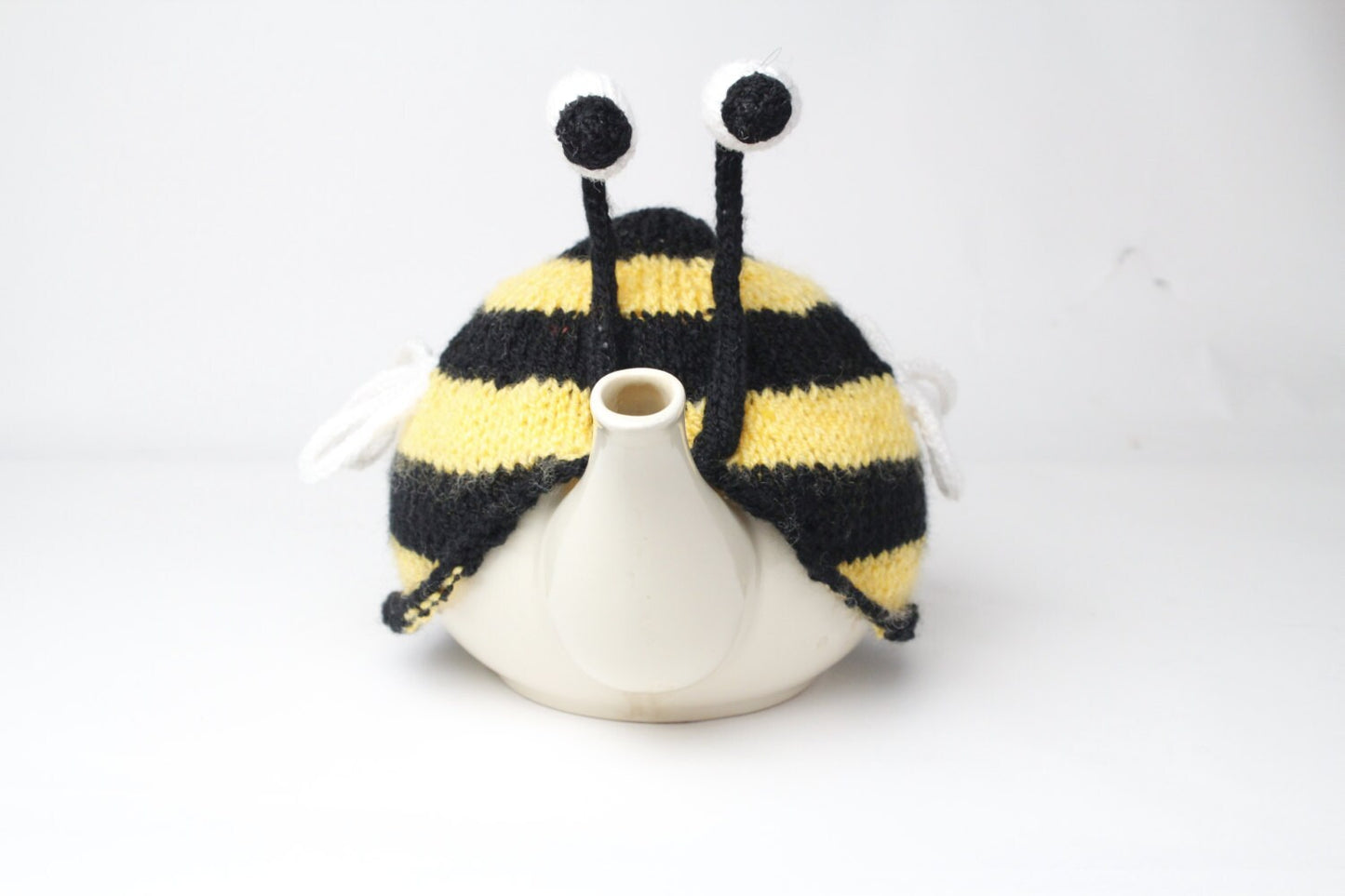 Bumble bee tea cosy. Hand knitted stripy bee cosie in washable yarn.