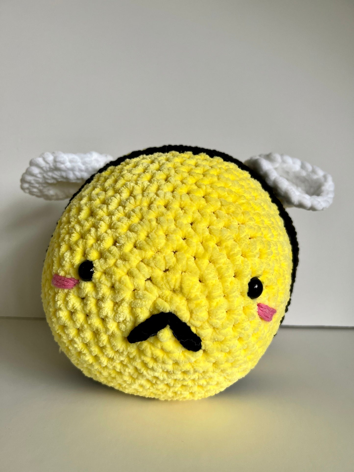 Jumbo the bumble bee - hand crochet super sized chenille cuddle buddy. Available with happy or sad face. Super squishy comforter.