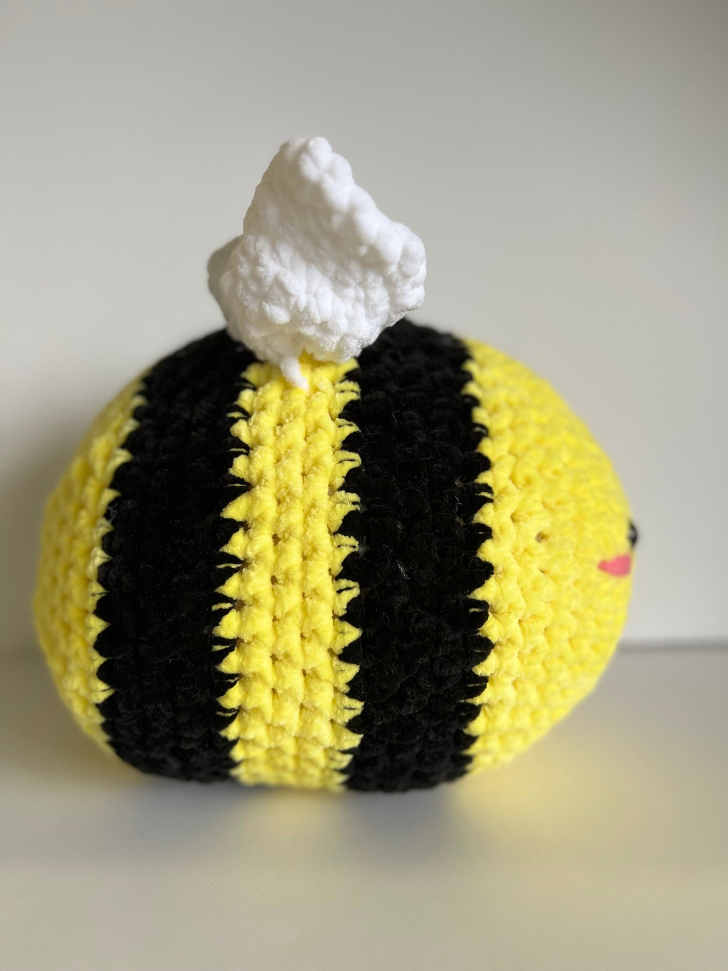 Jumbo the bumble bee - hand crochet super sized chenille cuddle buddy. Available with happy or sad face. Super squishy comforter.