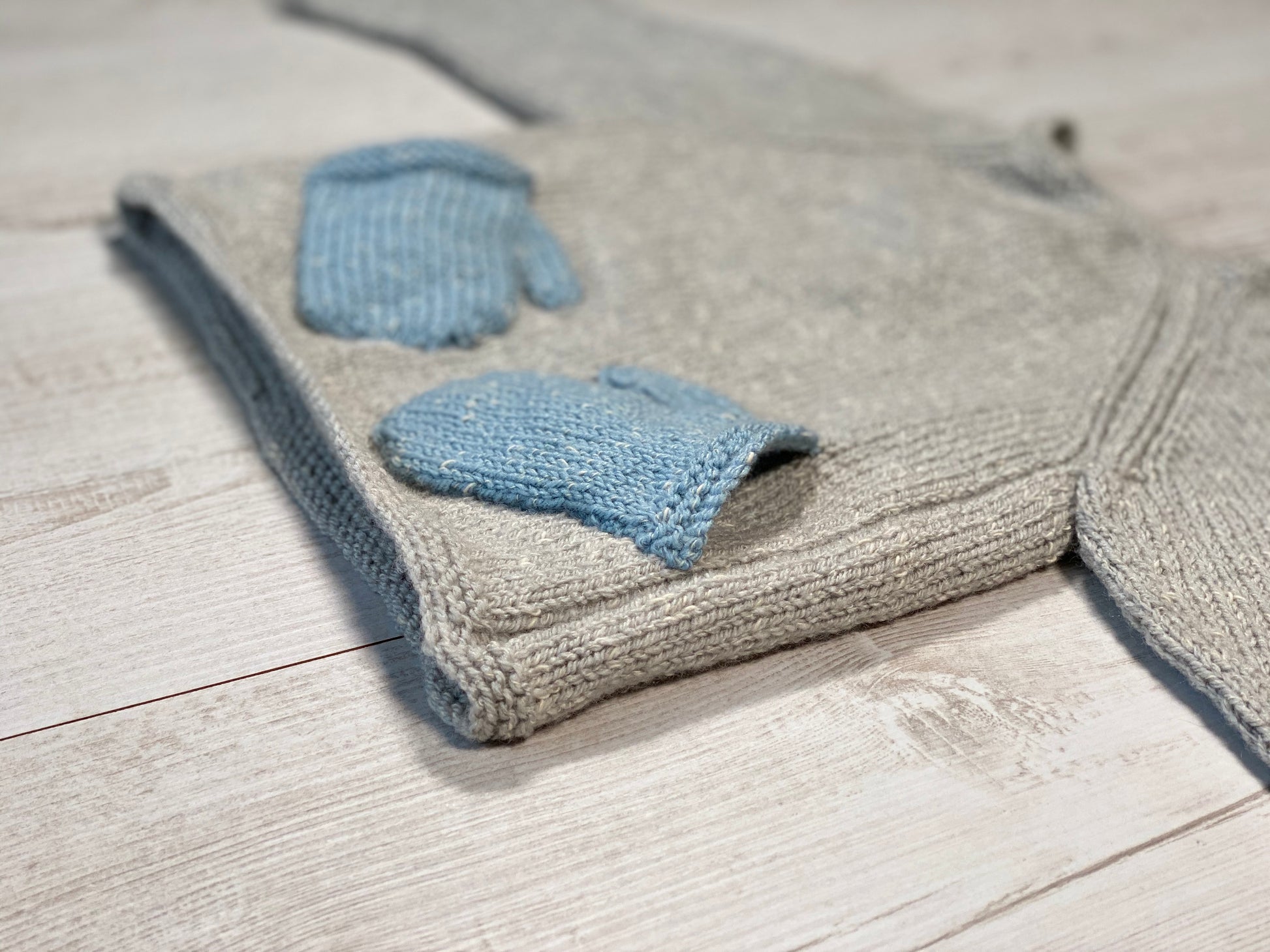 Little knits sweater with mittens on the front by Ruperts House