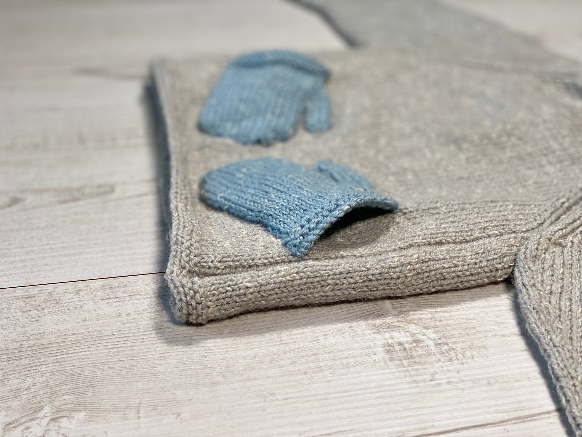 Little knits sweater with mittens on the front by Ruperts House