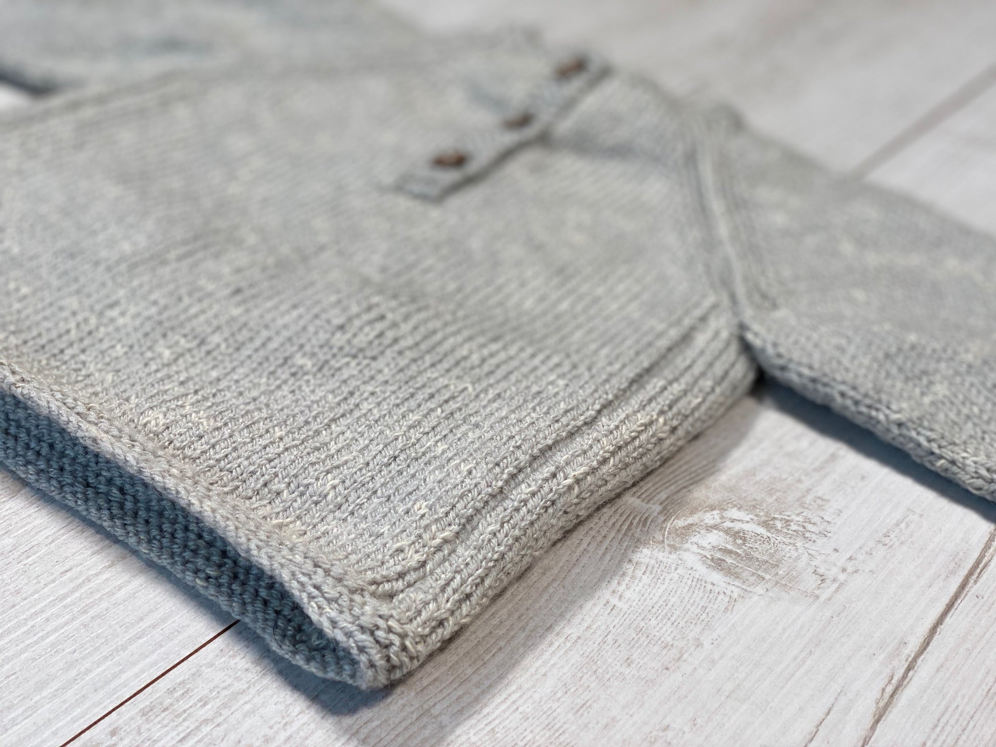 Little knits sweater with mittens on the front by Ruperts House
