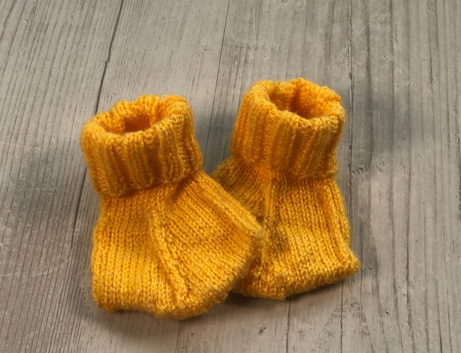 Duck flamingo dinosaur baby boots. Hand knitted washable and can be made in any colour.