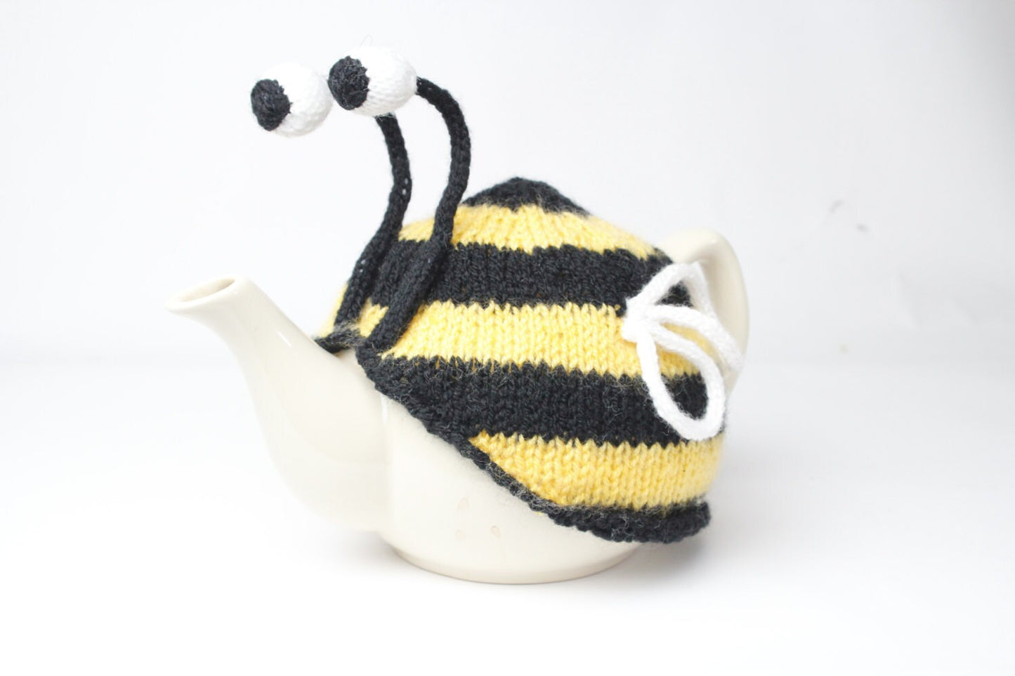 Bumble bee tea cosy. Hand knitted stripy bee cosie in washable yarn.