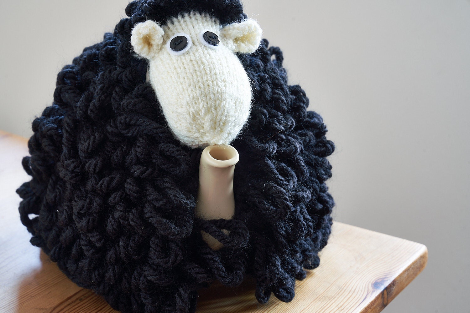 Mabel the sheep tea cosy hand knitted in chunky cream yarn