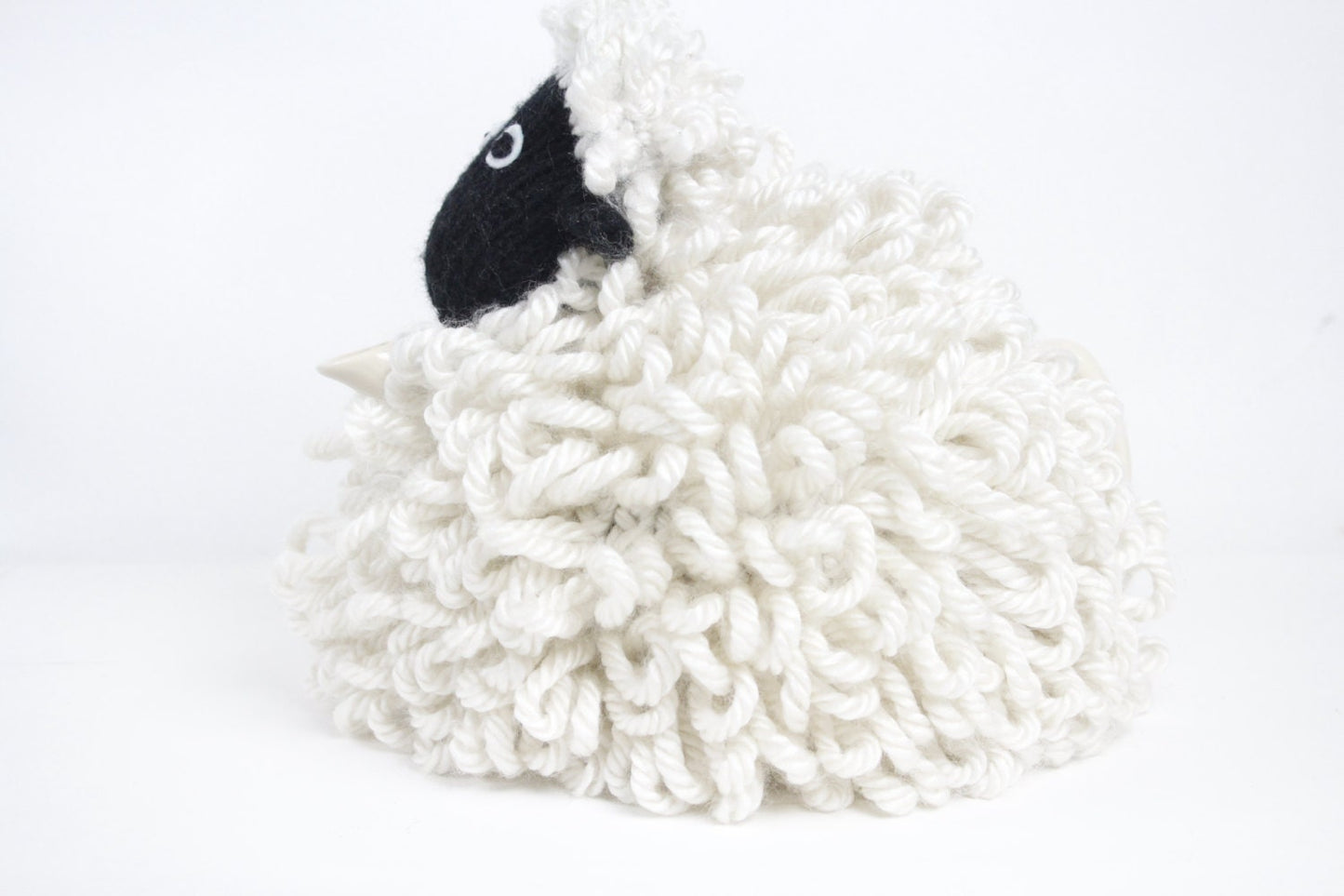 Mabel the sheep tea cosy hand knitted in chunky cream yarn