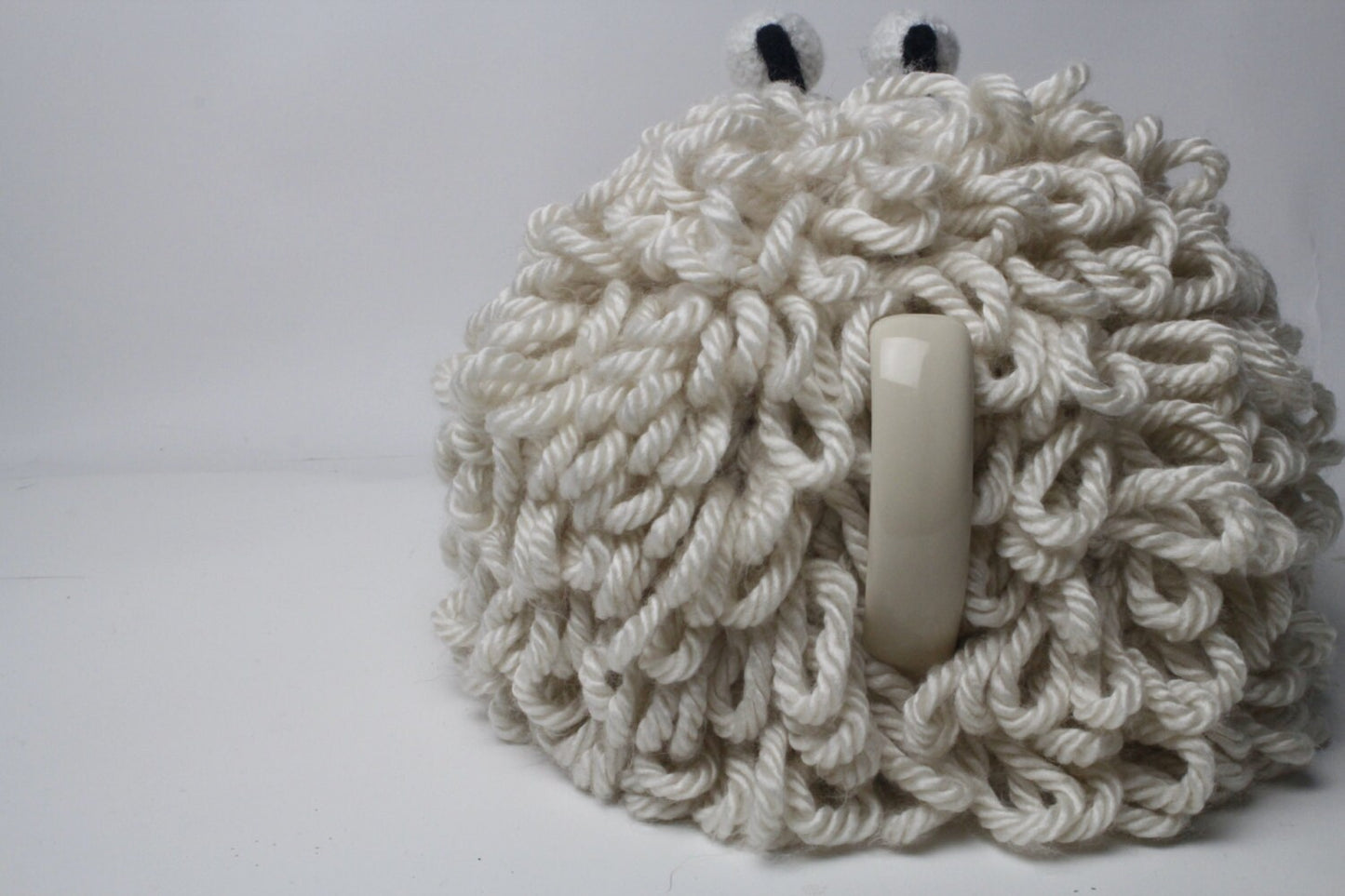Dolly the Sheep hand knitted woolly tea cosy.