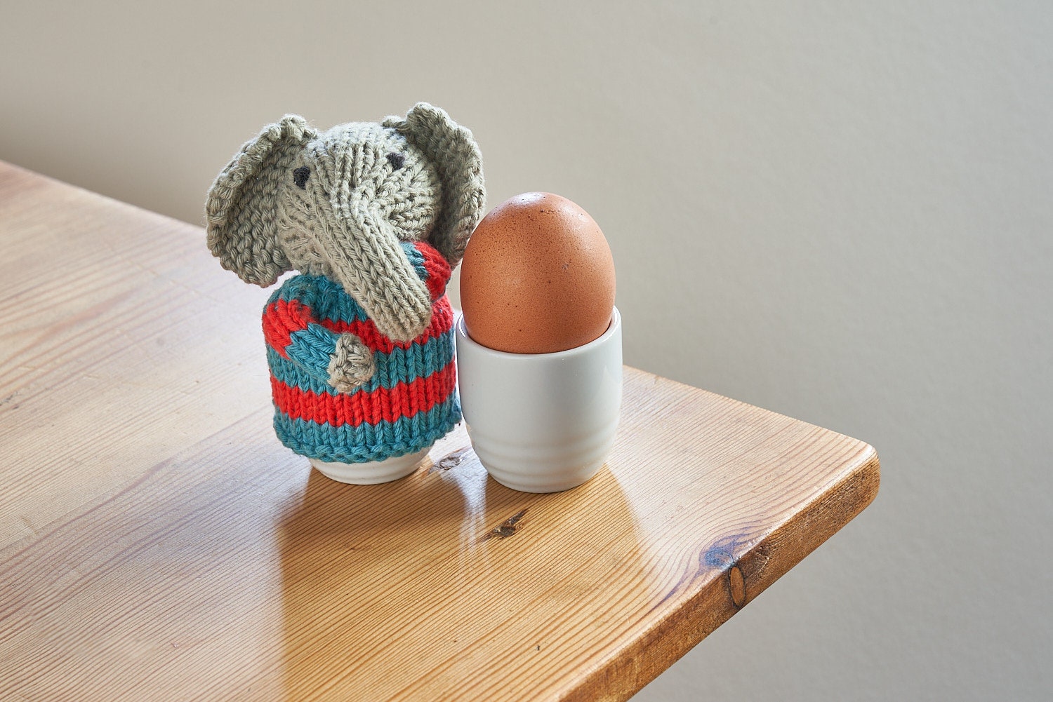 Egg cosy elephants by Rupert's House - hand knitted in washable cotton yarn.