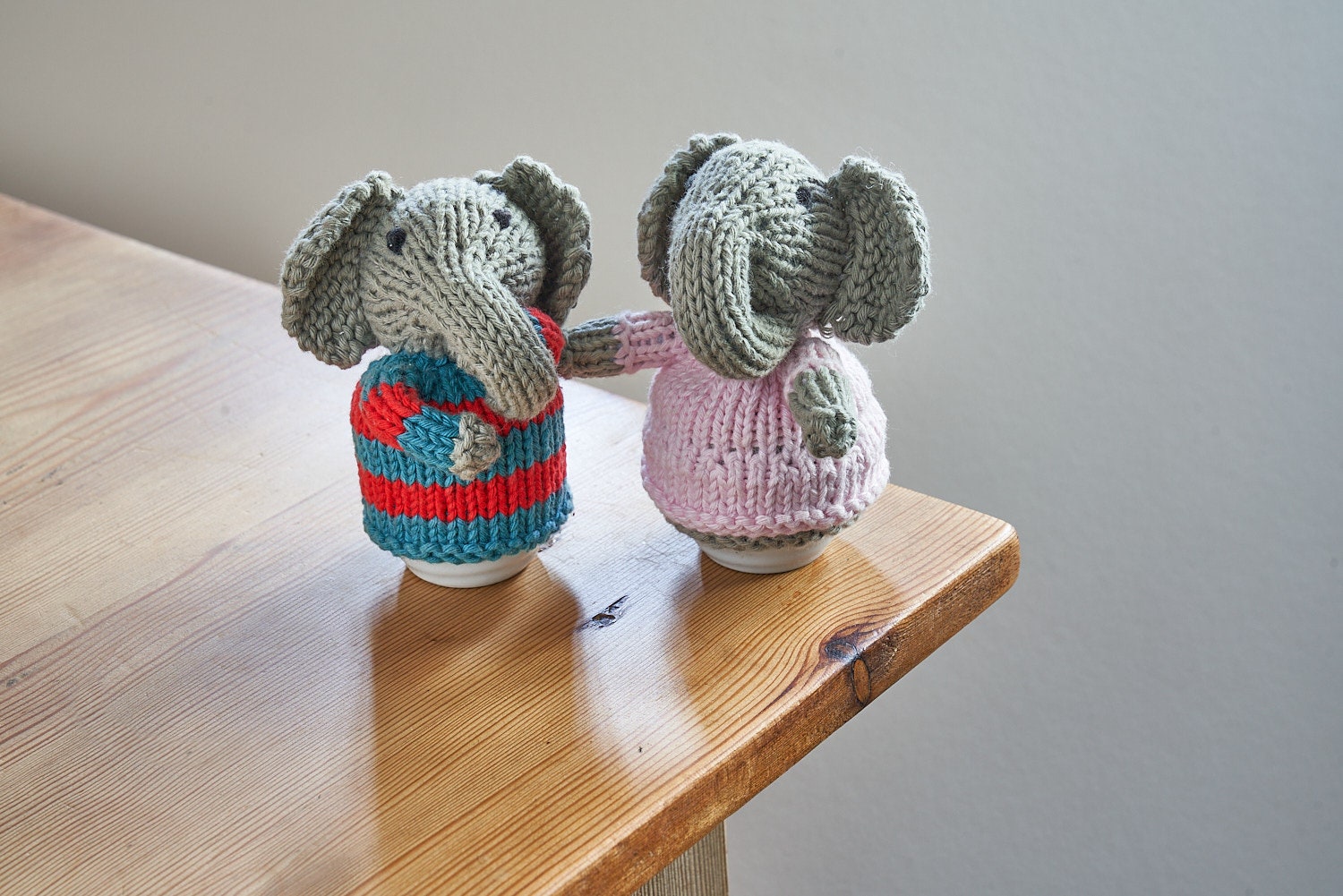 Egg cosy elephants by Rupert's House - hand knitted in washable cotton yarn.