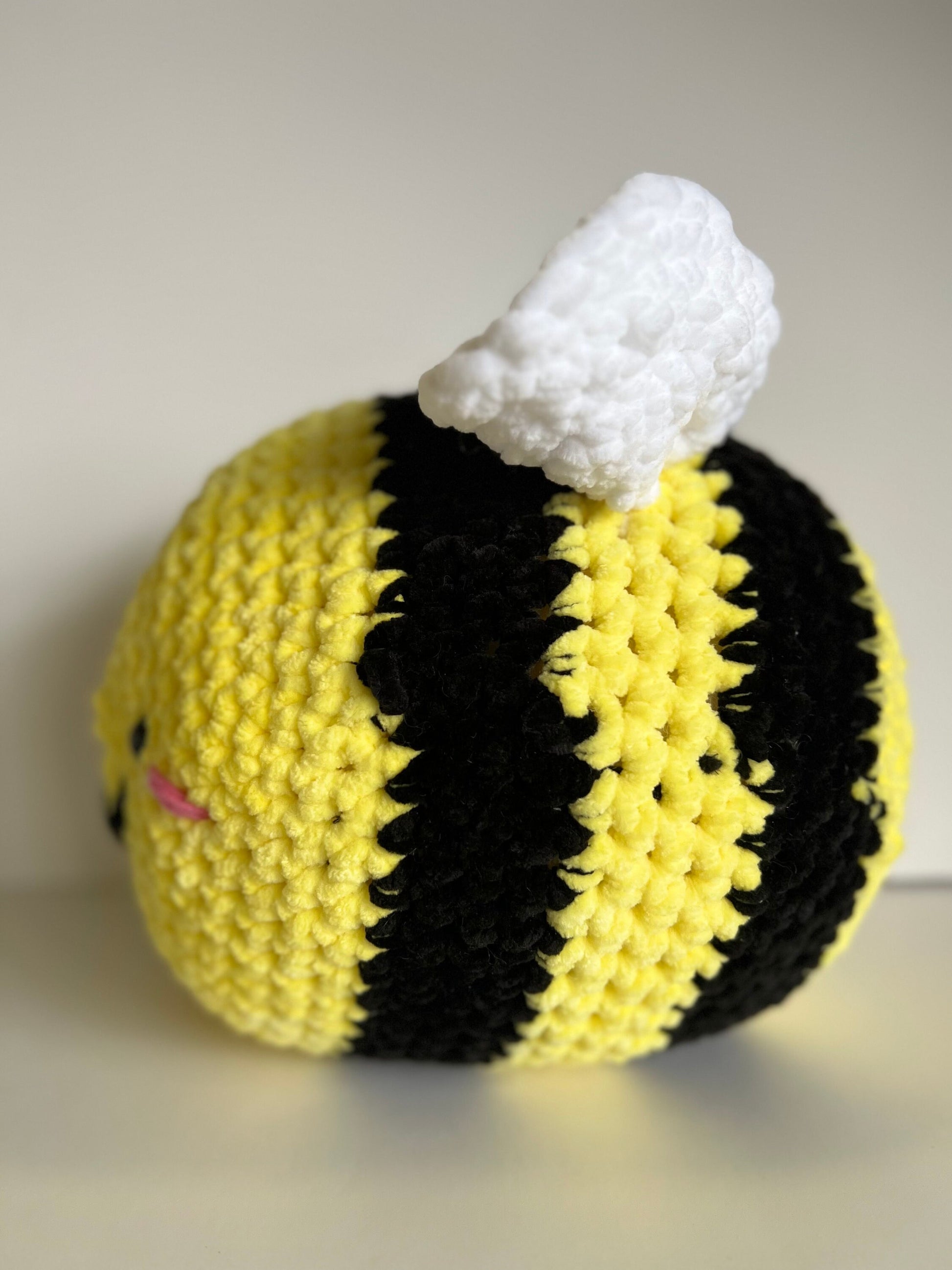 Jumbo the bumble bee - hand crochet super sized chenille cuddle buddy. Available with happy or sad face. Super squishy comforter.