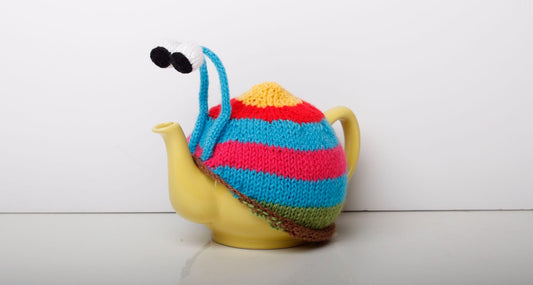 Knitted blue stripy snail tea cosy. Tea lovers teatime treat.