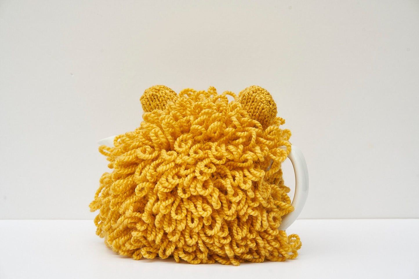 Lion tea cosy with loopy shaggy hand knitted mane for 6 cup tea pot