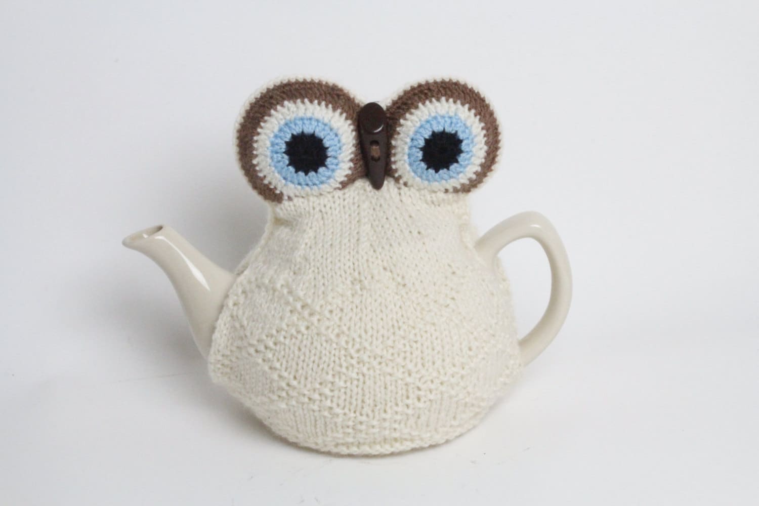 Owl tea cosie hand knitted in supersoft washable yarn with toggle beak and large padded eyes