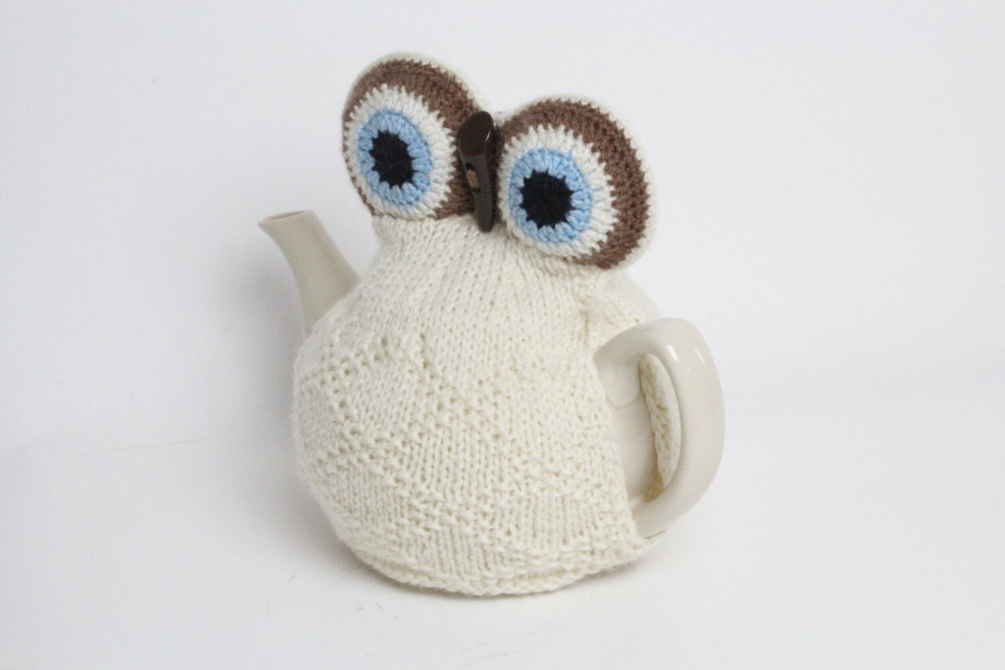 Owl tea cosie hand knitted in supersoft washable yarn with toggle beak and large padded eyes