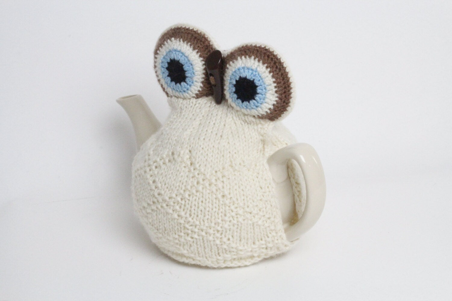 Owl tea cosie hand knitted in supersoft washable yarn with toggle beak and large padded eyes
