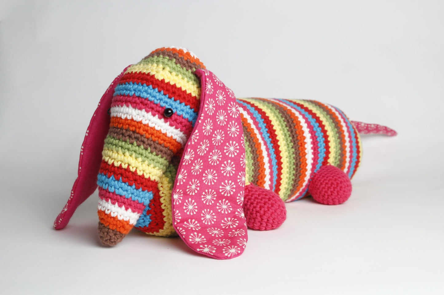 Stripy dachshund sausage dog crochet doorstop or draught excluder.