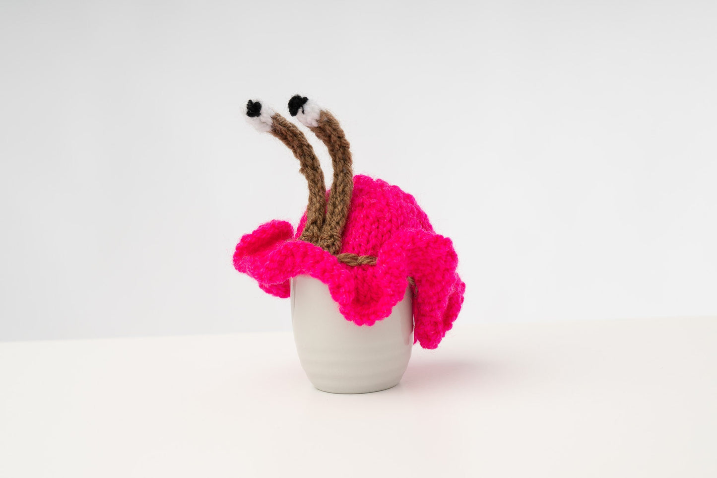 Knitted pink tea or egg cosies. Available in 6 cup, 2 cup or egg cosie size.