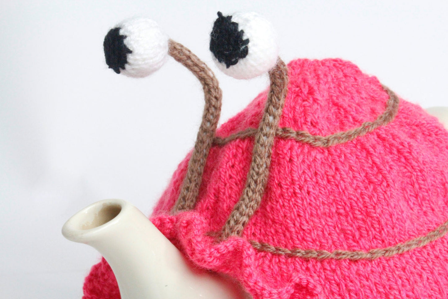 Knitted pink tea or egg cosies. Available in 6 cup, 2 cup or egg cosie size.