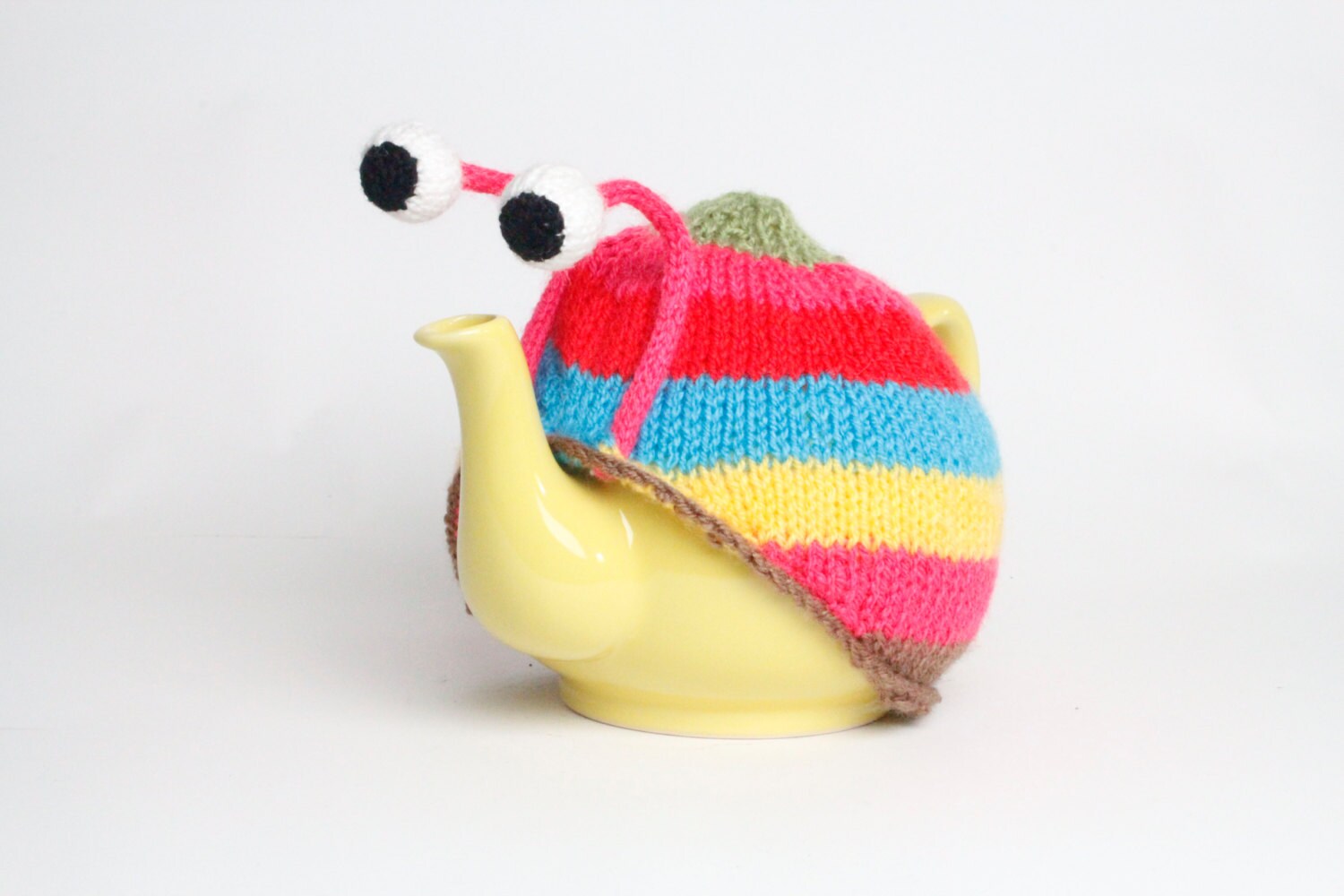 Knitted pink stripy snail tea cosy. Tea lovers teatime treat.