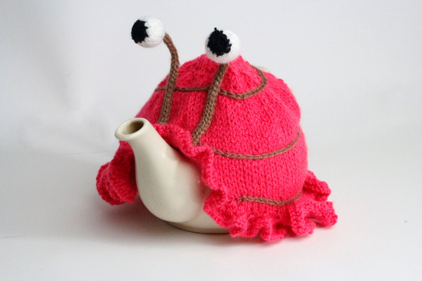 Knitted pink tea or egg cosies. Available in 6 cup, 2 cup or egg cosie size.