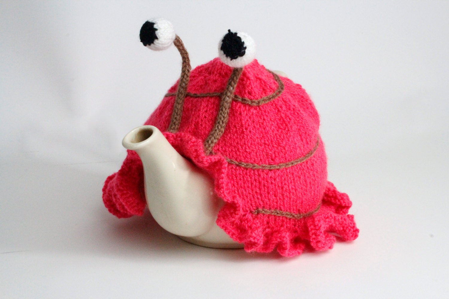 Knitted pink tea or egg cosies. Available in 6 cup, 2 cup or egg cosie size.