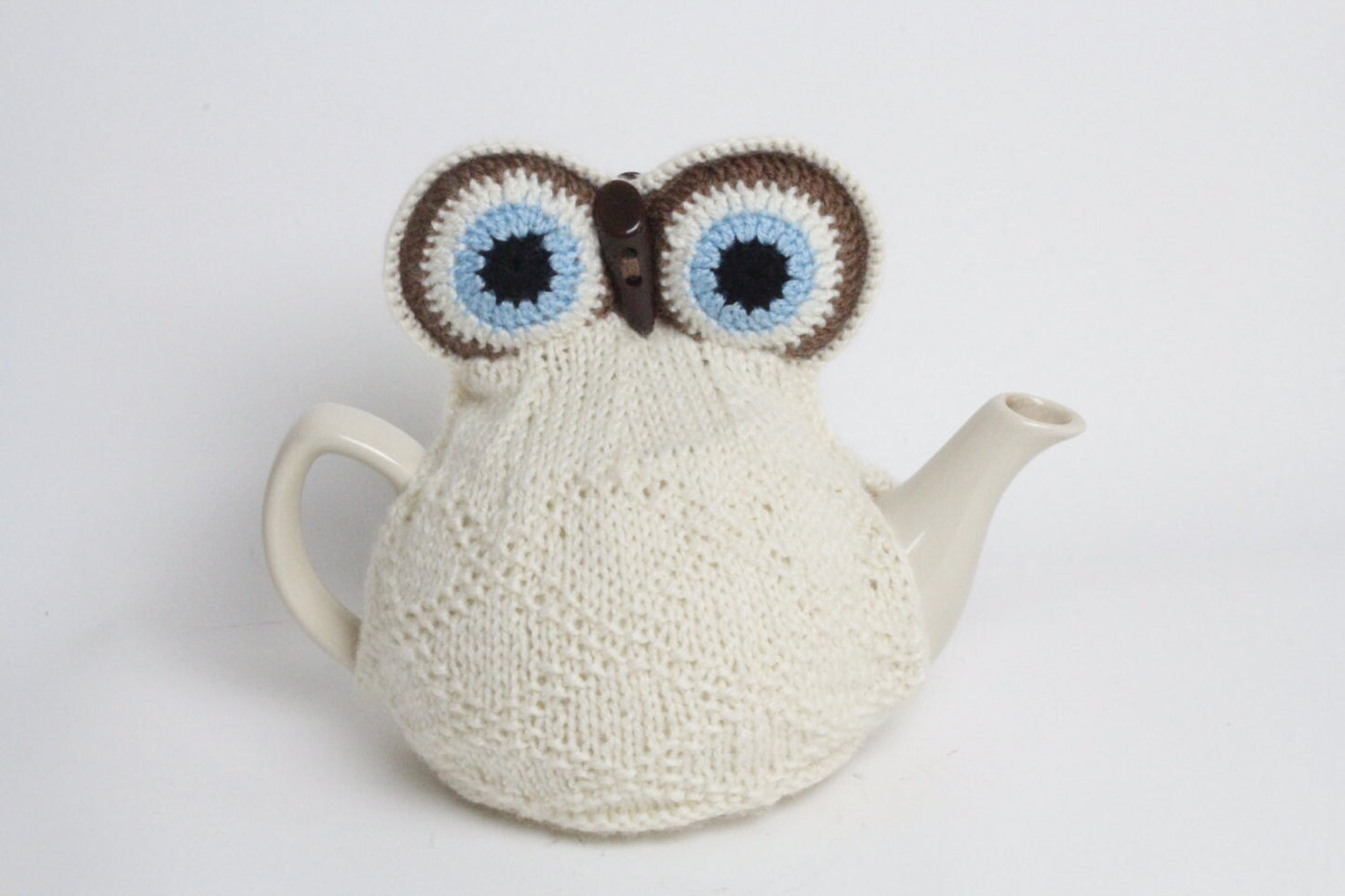 Owl tea cosie hand knitted in supersoft washable yarn with toggle beak and large padded eyes